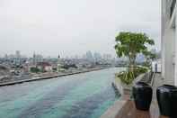 Swimming Pool Cozy and Nice Stay Studio Apartment at Nine Residence By Travelio