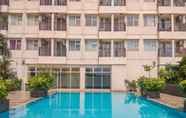 Swimming Pool 4 Cozy and Simple Living Studio Apartment at Margonda Residence 3 By Travelio