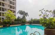 Swimming Pool 5 Cozy and Simple Living Studio Apartment at Margonda Residence 3 By Travelio