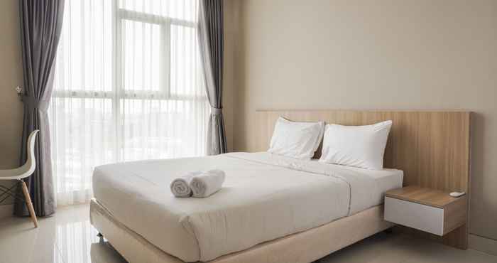 Bedroom Comfort Living and Minimalist 1BR at Ciputra International Apartment By Travelio