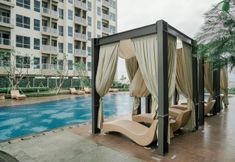 Swimming Pool 7 Homey and Comfort Studio at Green Sedayu Apartment By Travelio