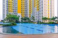 Swimming Pool Comfort Living and Minimalist 2BR at Springlake Summarecon Bekasi Apartment By Travelio