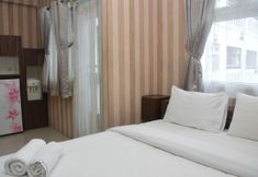 卧室 2 Comfort and Cozy Living Studio at Green Pramuka City Apartment By Travelio