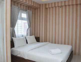 Bedroom 2 Comfort and Cozy Living Studio at Green Pramuka City Apartment By Travelio