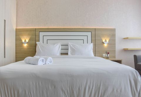 Bedroom Cozy Design Fully Furnished Studio at Menteng Park Apartment By Travelio