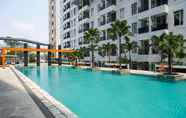 Swimming Pool 5 Cozy Stay and Modern 1BR at Gardenia Boulevard Apartment By Travelio
