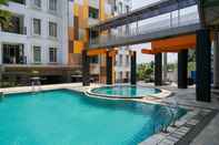 Swimming Pool Cozy Stay and Modern 1BR at Gardenia Boulevard Apartment By Travelio