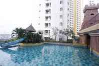 Swimming Pool Cozy and Simply Pool View 2BR at Great Western Apartment By Travelio
