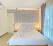Bedroom 2 Minimalist and Deluxe 1BR at Pine Tree Resort Condominium By Travelio