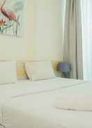 BEDROOM Tidy and Comfy 1BR Apartment at Tree Park City BSD By Travelio