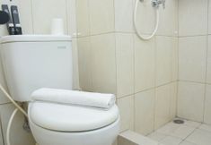 In-room Bathroom 4 Minimalist and Simply Studio at Springlake Summarecon Bekasi Apartment By Travelio