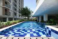 Swimming Pool Nice and Comfy 2BR at Paradise Mansion Apartment By Travelio