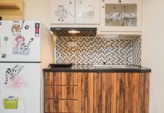 Common Space 5 Comfort 1BR Apartment with Working Room at Meikarta By Travelio