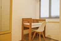 Common Space Comfort 1BR Apartment with Working Room at Meikarta By Travelio