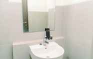 In-room Bathroom 4 Comfy and Minimalist Studio at Bintaro Icon Apartment By Travelio