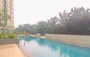 Swimming Pool 7 Well Furnished Studio Apartment at Transpark Cibubur By Travelio