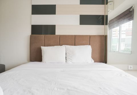 Bedroom Minimalist and Comfort Living 1BR at Bassura City Apartment By Travelio