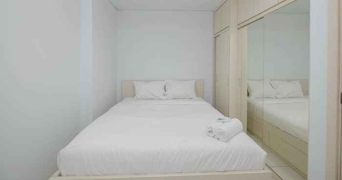 Kamar Tidur Homey and Comfy 2BR at Patraland Urbano Apartment By Travelio