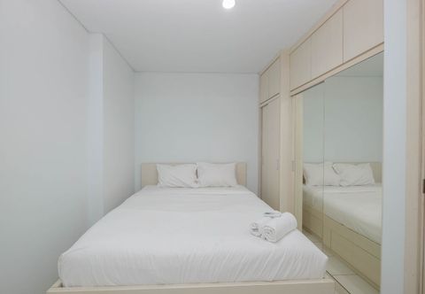 Bedroom Homey and Comfy 2BR at Patraland Urbano Apartment By Travelio