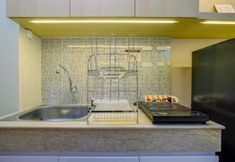 Common Space 3 Minimalist and Comfy Studio at Evenciio Margonda Apartment By Travelio