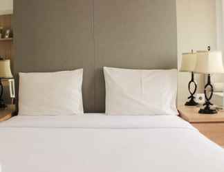 Bedroom 2 Comfort Studio Apartment at Oasis Cikarang By Travelio