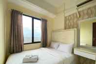 Bedroom Bright 2BR Apartment at Tamansari Panoramic By Travelio