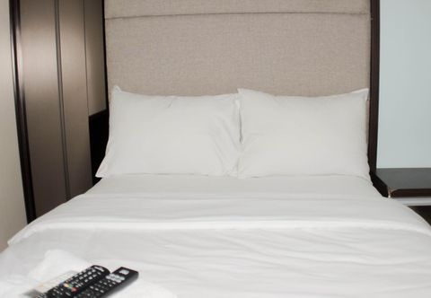 Bedroom Fancy Studio Apartment at Springlake Summarecon Bekasi By Travelio