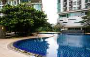 Swimming Pool 6 Elegant and Comfort 2BR at Woodland Park Residence Apartment By Travelio