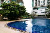 Swimming Pool Elegant and Comfort 2BR at Woodland Park Residence Apartment By Travelio