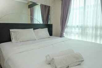 Kamar Tidur 4 Elegant and Comfort 2BR at Woodland Park Residence Apartment By Travelio