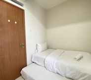 Bedroom 2 Cozy 2BR Apartment at Pinewood Jatinangor By Travelio