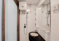 In-room Bathroom 4 Minimalist and Cozy Studio Room at Sky House BSD Apartment By Travelio