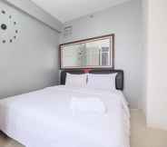 Bedroom 6 Warm and Comfort 2BR at Bassura City Apartment By Travelio