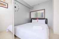 Bedroom Warm and Comfort 2BR at Bassura City Apartment By Travelio