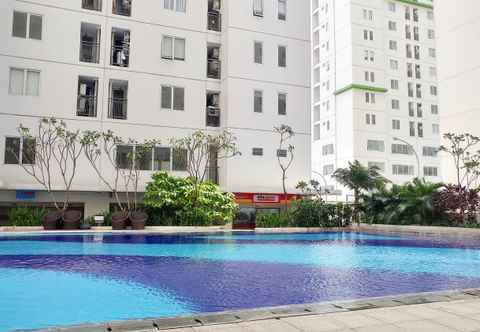 Swimming Pool Warm and Comfort 2BR at Bassura City Apartment By Travelio