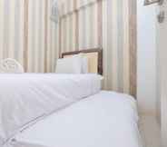 Bedroom 7 Warm and Comfort 2BR at Bassura City Apartment By Travelio