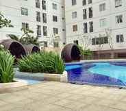 Lobby 2 Warm and Comfort 2BR at Bassura City Apartment By Travelio