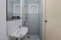 In-room Bathroom Minimalist and Cozy Studio (No Kitchen) at Aeropolis Apartment By Travelio