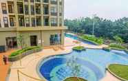 Swimming Pool 7 Homey and Simply Studio Transpark Cibubur Apartment By Travelio