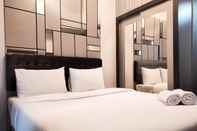 Kamar Tidur Elegant and Nice Studio at Vida View Makassar Apartment By Travelio