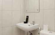 In-room Bathroom 5 Cozy Stay 2BR at Apartment Springlake Summarecon Bekasi By Travelio