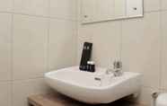 In-room Bathroom 4 Modern 2BR at Apartment Springlake Summarecon Bekasi By Travelio