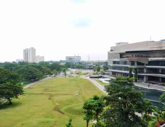 Bangunan 2 Serene Exclusive Modern Studio at Grand Sungkono Lagoon Apartment By Travelio