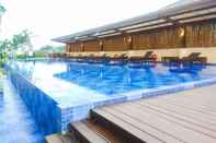 Swimming Pool Cozy and Warm Studio at Azalea Suites Apartment By Travelio