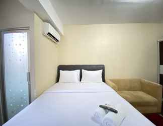 Bedroom 2 Cozy Studio Apartment at Emerald Towers By Travelio