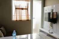 Common Space Homey and Cozy Stay 2BR at Green Pramuka City Apartment By Travelio