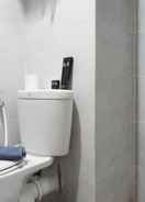 BATHROOM Stylish and Compact Studio Apartment at Taman Melati Surabaya By Travelio