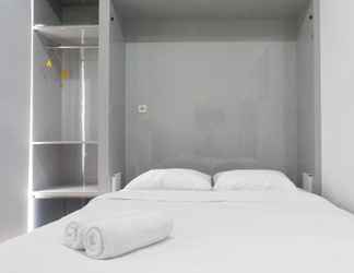 Bedroom 2 Stylish and Compact Studio Apartment at Taman Melati Surabaya By Travelio