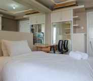 Bedroom 4 Fancy and Nice Studio at Green Pramuka City Apartment By Travelio