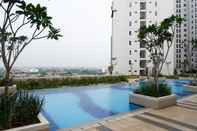 Swimming Pool Strategic and Comfort 2BR at Bassura City Apartment By Travelio